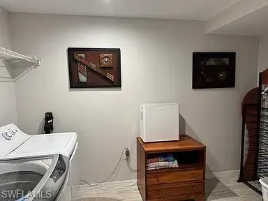 a view of a workspace with furniture