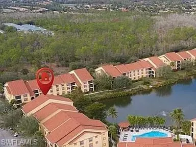 an aerial view of a house with a lake view