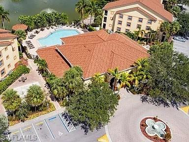 7905 Preserve Circle, Unit 138 Naples, FL 34119 - Photo 24 of 27 an aerial view of a house with a yard and a large pool