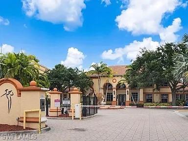 7905 Preserve Circle, Unit 138 Naples, FL 34119 - Photo 25 of 27 a front view of a building with streets and trees