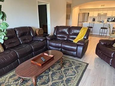 7905 Preserve Circle, Unit 138 Naples, FL 34119 - Photo 5 of 27 a living room with furniture and a rug