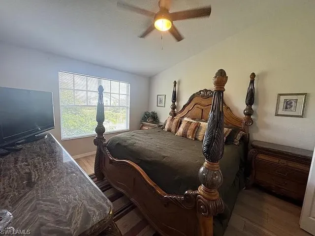 a bed room with a bed and a window