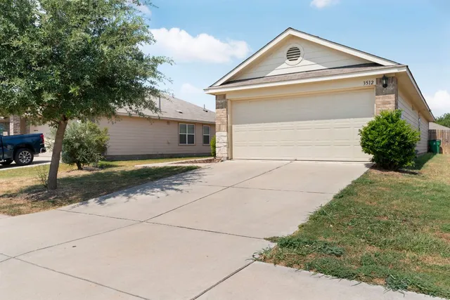 a view of front of house with garage