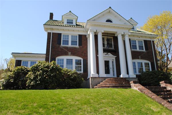 a front view of a house with a yard