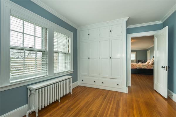 40 Hutchinson Road Arlington, MA 02474 - Photo 16 of 23 a view of a room that has a bed and wooden floor