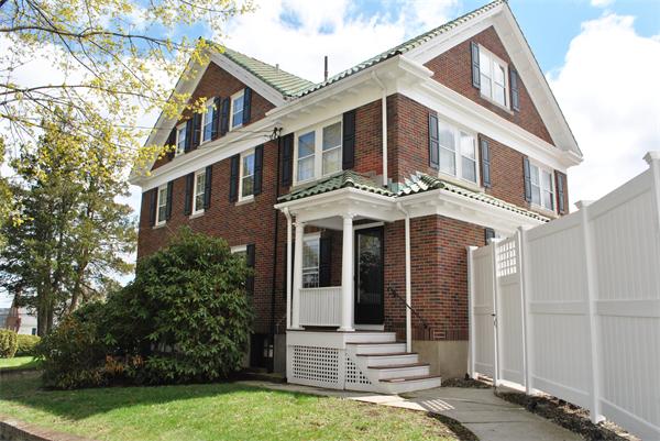 40 Hutchinson Road Arlington, MA 02474 - Photo 2 of 23 a front view of a house with garden