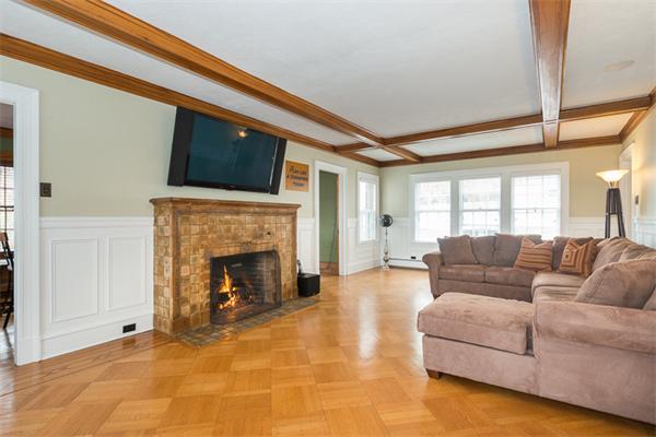 40 Hutchinson Road Arlington, MA 02474 - Photo 5 of 23 a living room with furniture and a fireplace