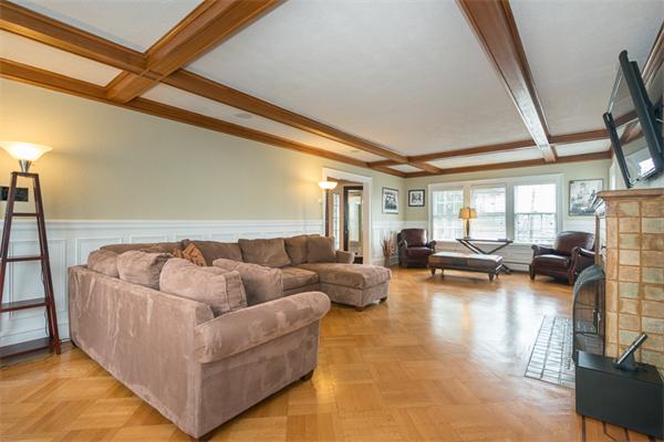 40 Hutchinson Road Arlington, MA 02474 - Photo 6 of 23 a living room with furniture and a large window