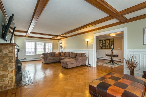 40 Hutchinson Road Arlington, MA 02474 - Photo 7 of 23 a living room with furniture and a large window
