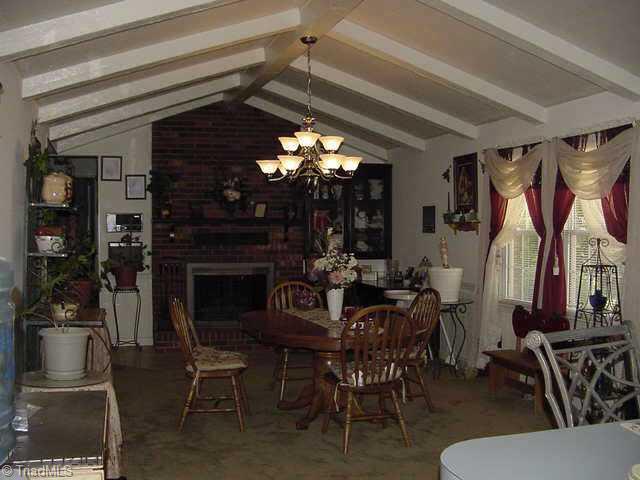 173 Farmbrook Road Mount Airy, NC 27030 - Photo 3 of 9 Other. Kitchen/Den/Dining Combination with fireplace