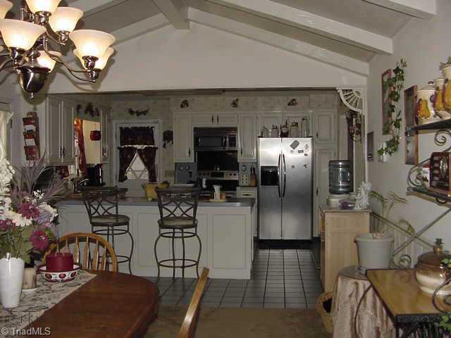 173 Farmbrook Road Mount Airy, NC 27030 - Photo 4 of 9 Other. Kitchen/Den/Dining Combination with fireplace
