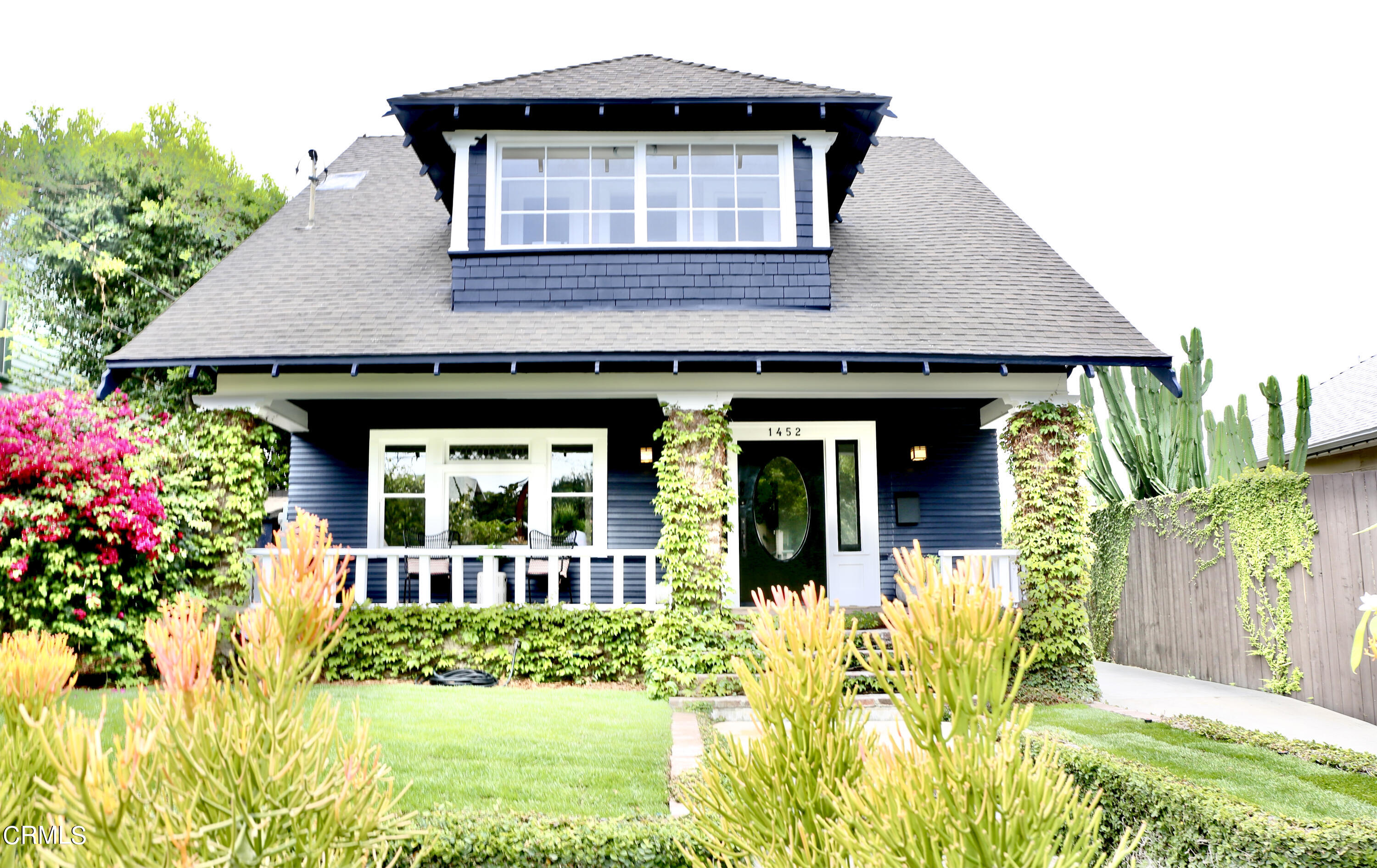 front view of a house with a yard