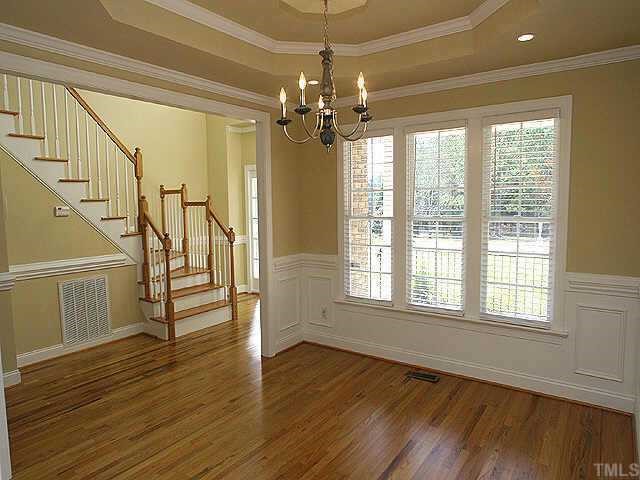 2800 Candlehurst Lane Raleigh, NC 27616 - Photo 3 of 9 a view of an empty room with wooden floor and a window