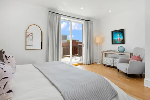 a bedroom with furniture and window