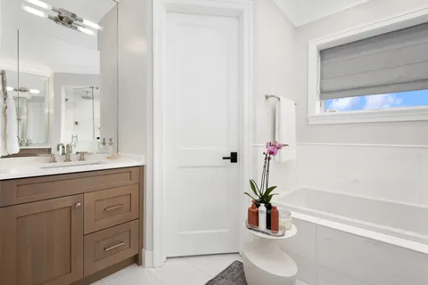 a bathroom with a sink a vanity and a mirror