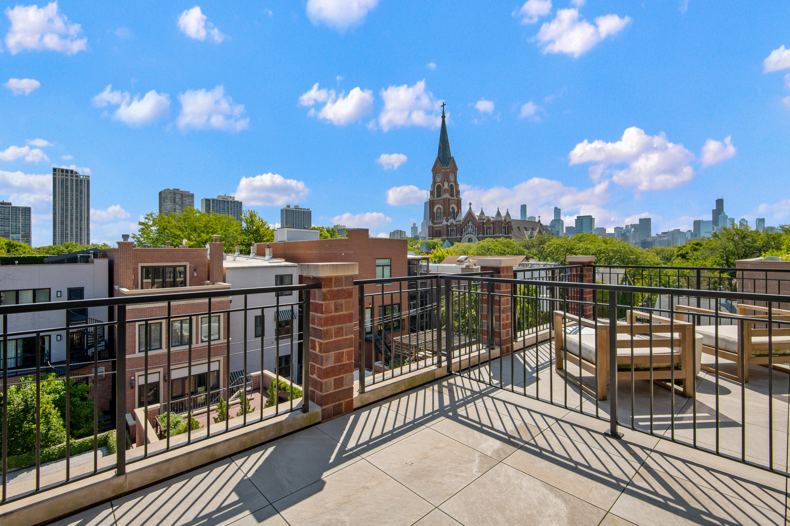 1733 North Mohawk Street, Unit 3N Chicago, IL 60614 - Photo 16 of 29 a view of a balcony with two chairs and a potted plant
