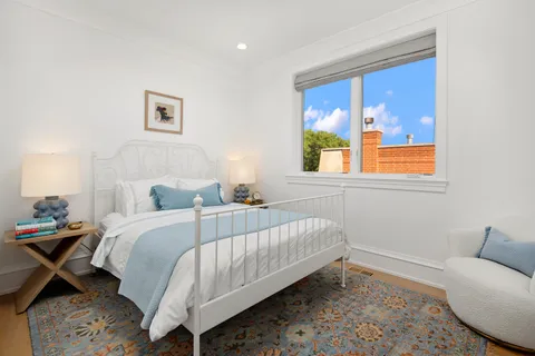 a bed room with a bed and a window