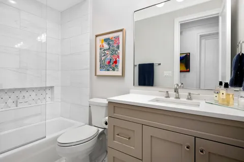 a bathroom with a toilet a sink and a bathtub