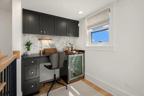 a view of a patio with table and chairs and potted plants