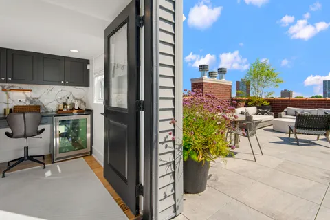 a view of a swimming pool with furniture