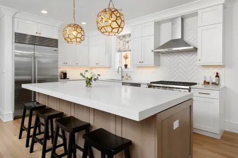 a kitchen with a sink cabinets and window