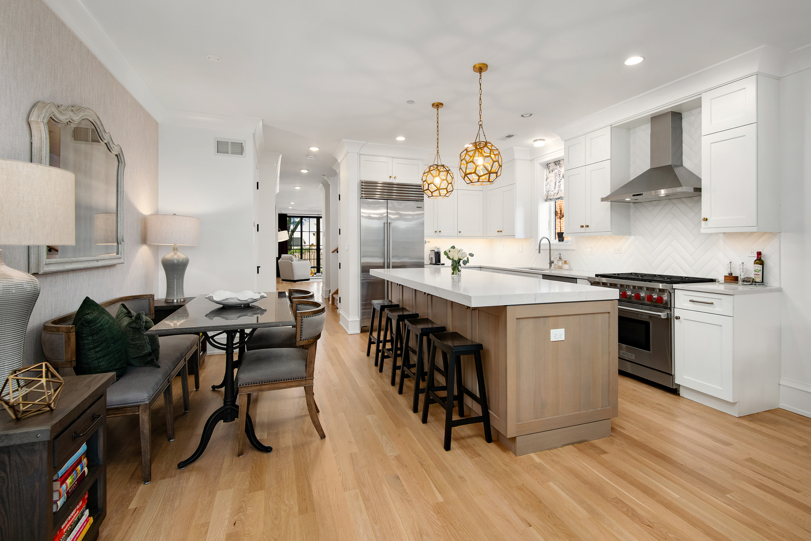 1733 North Mohawk Street, Unit 3N Chicago, IL 60614 - Photo 7 of 29 a kitchen with stainless steel appliances granite countertop a stove a sink dishwasher a refrigerator and white cabinets with wooden floor