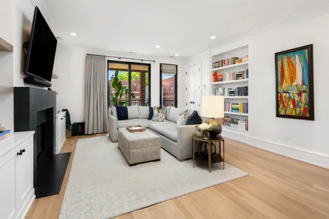 a living room with furniture fireplace and a flat screen tv