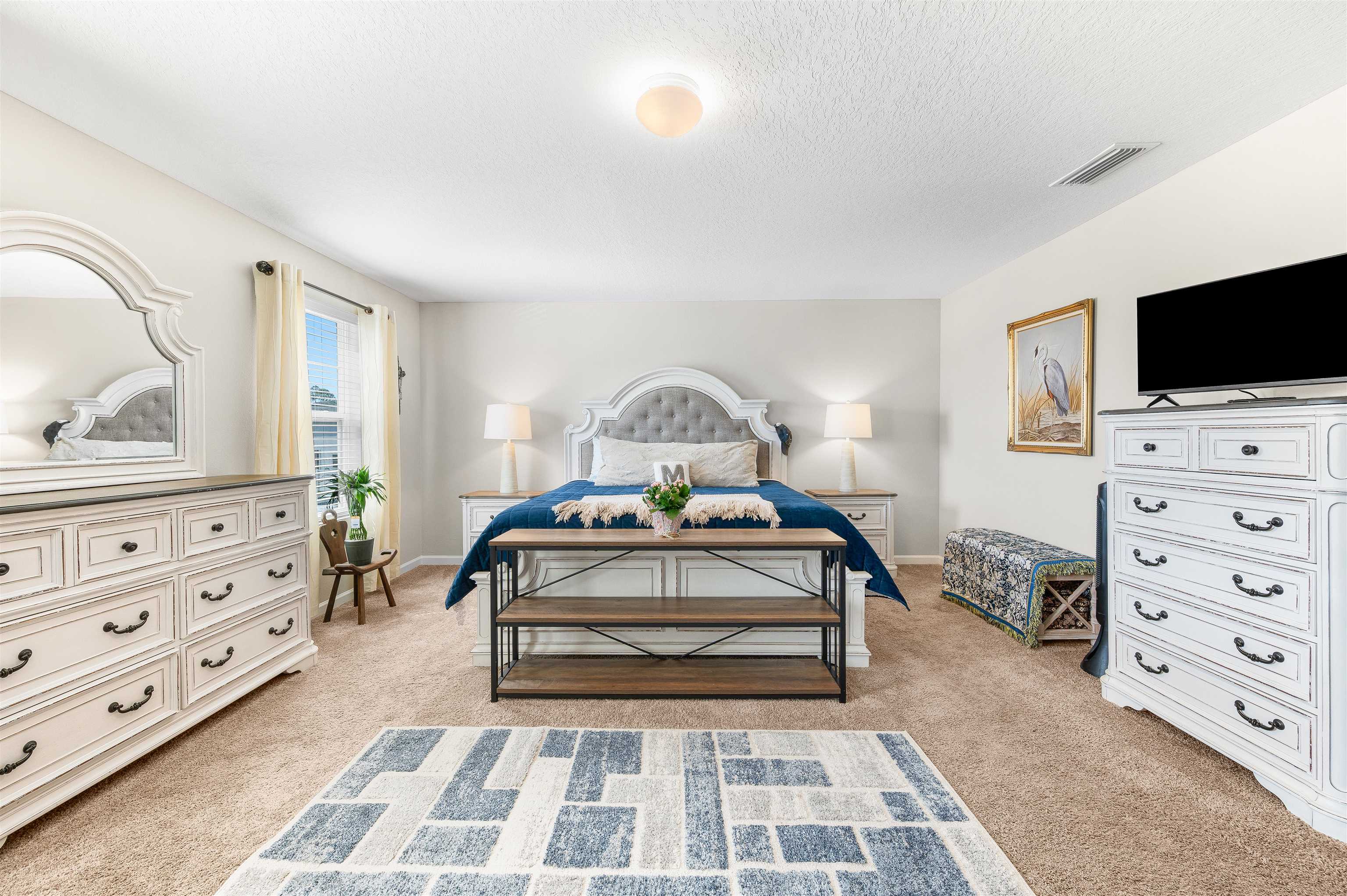 71 Barbosa Trail St. Augustine, FL 32095 - Photo 18 of 51 a view of a bedroom with furniture and flat screen tv