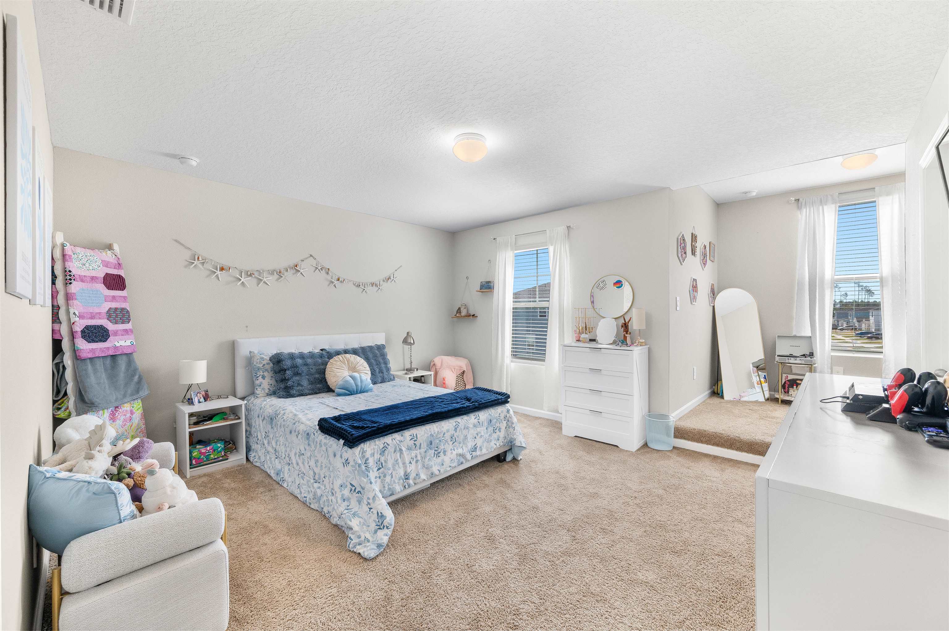 71 Barbosa Trail St. Augustine, FL 32095 - Photo 22 of 51 a spacious bedroom with a bed a couch and dresser