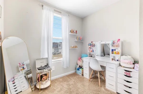 a bedroom with a bed and a table in it