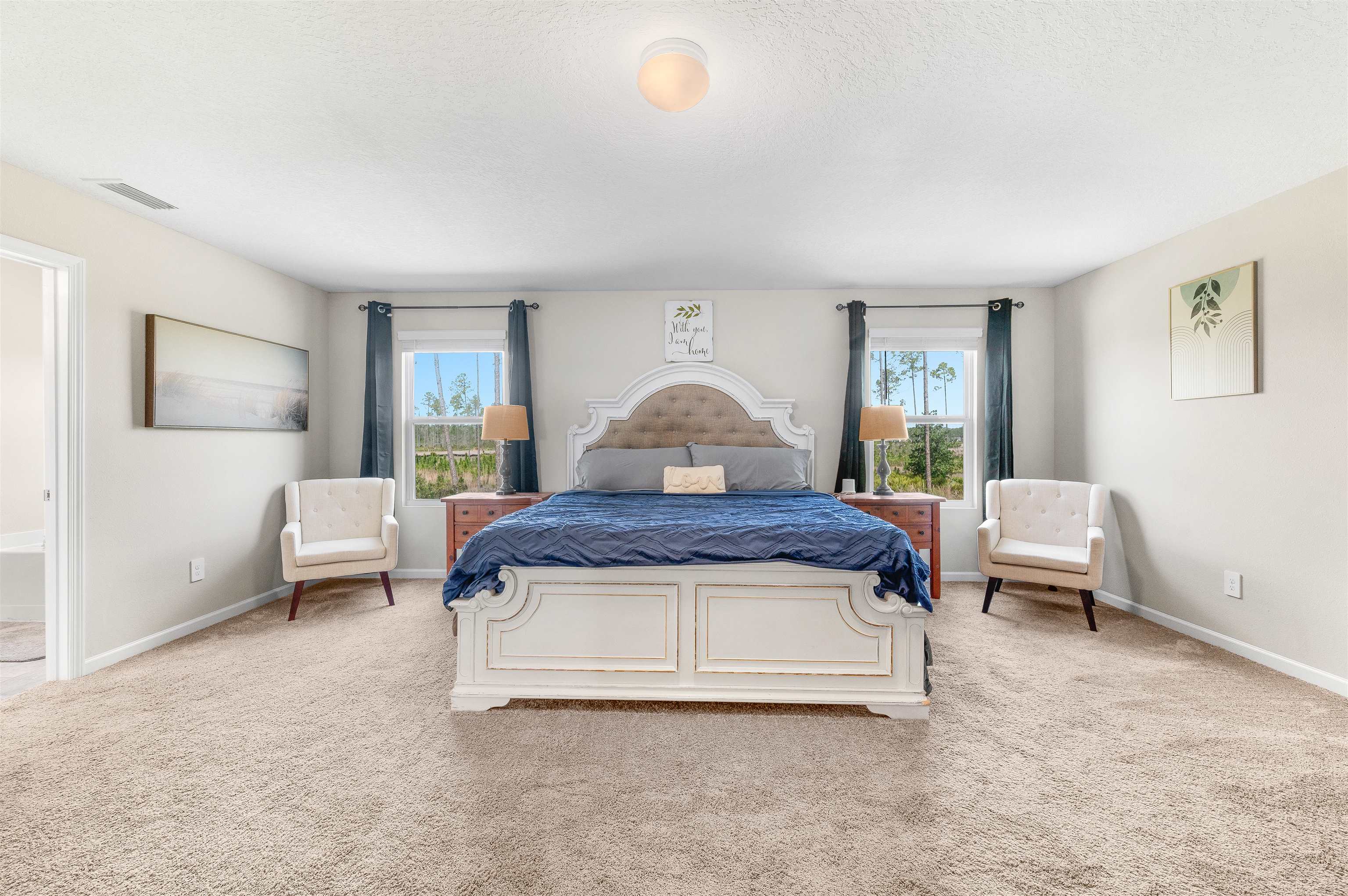 71 Barbosa Trail St. Augustine, FL 32095 - Photo 26 of 51 a spacious bedroom with a bed and a couch