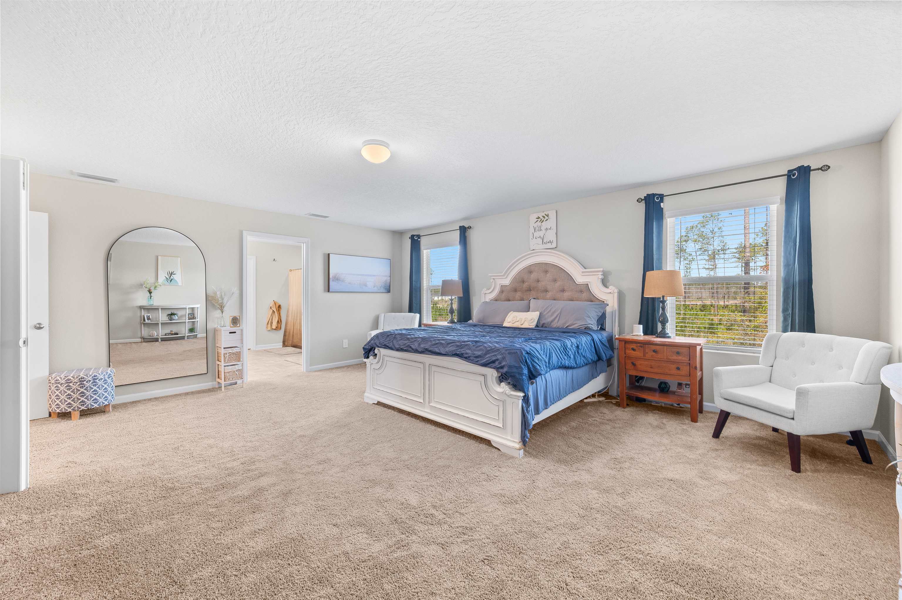 71 Barbosa Trail St. Augustine, FL 32095 - Photo 28 of 51 a spacious bedroom with a bed a table and window
