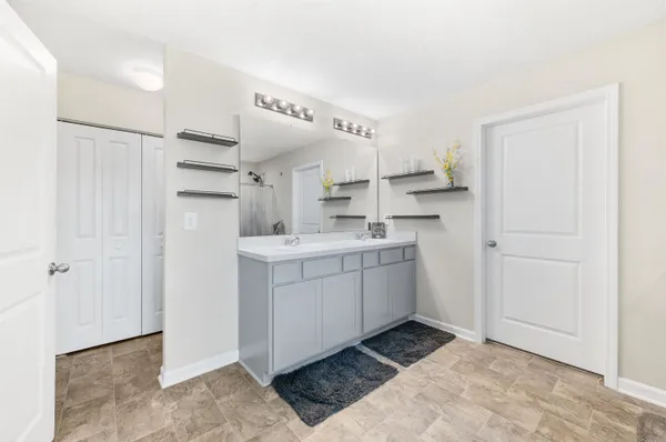 a room with a sink and cabinets