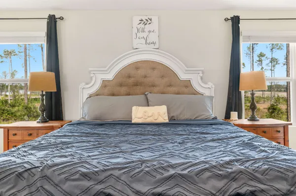 a bedroom with a bed and window