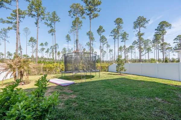 a view of a swimming pool with a lawn chairs