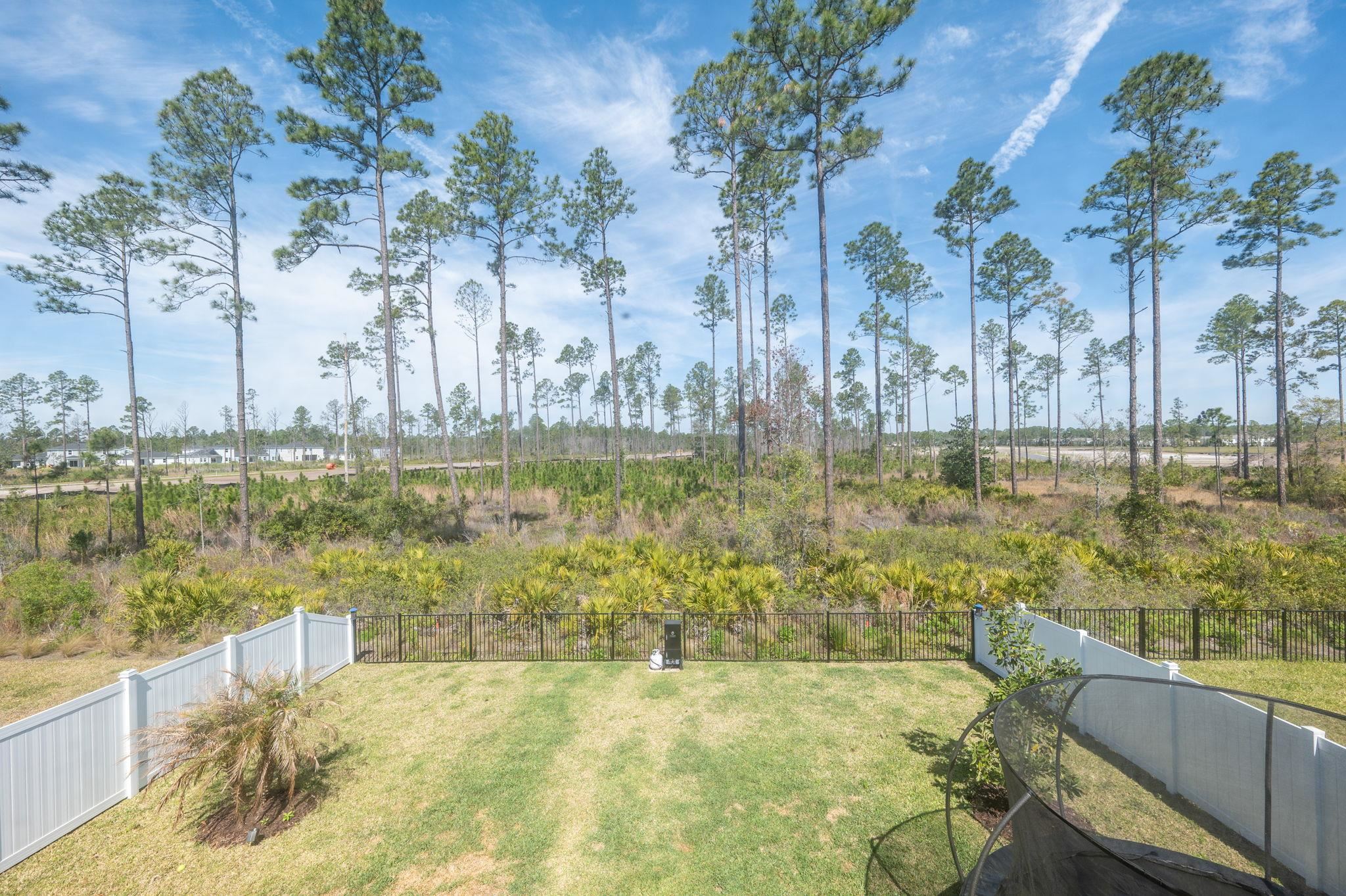 71 Barbosa Trail St. Augustine, FL 32095 - Photo 39 of 51 a view of a swimming pool with a lawn chairs