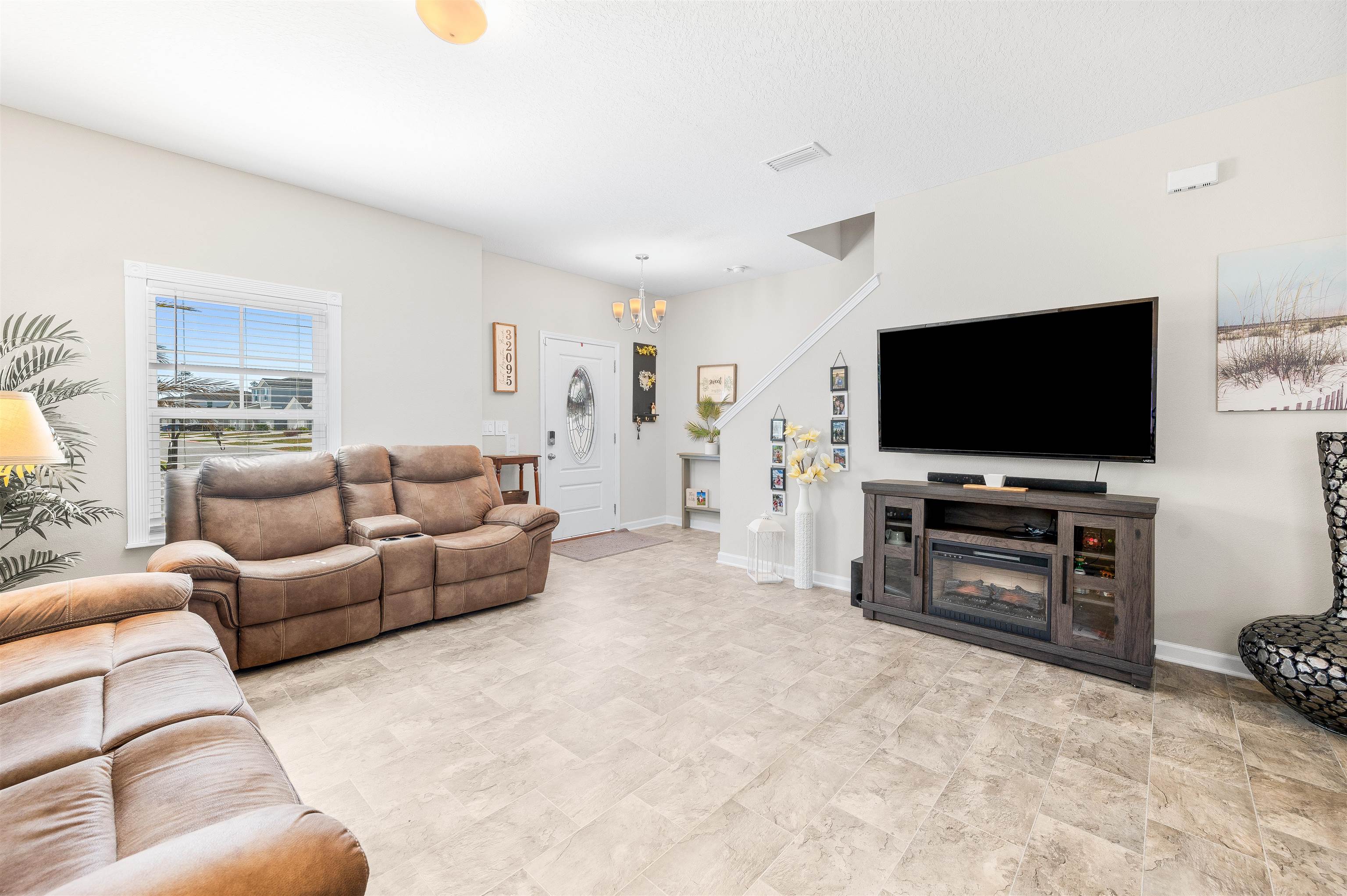 71 Barbosa Trail St. Augustine, FL 32095 - Photo 4 of 51 a living room with furniture and a flat screen tv