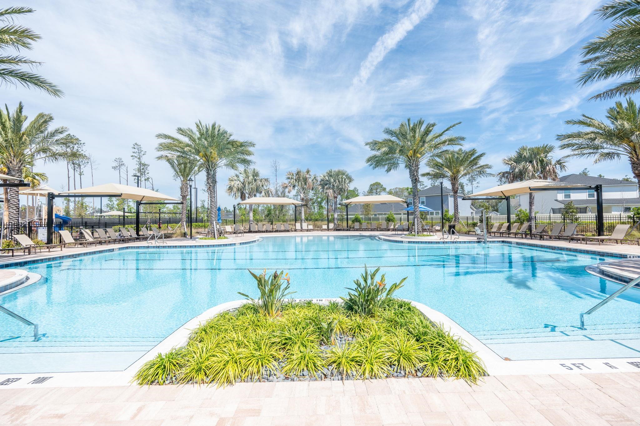 71 Barbosa Trail St. Augustine, FL 32095 - Photo 48 of 51 a view of swimming pool with outdoor seating and plants