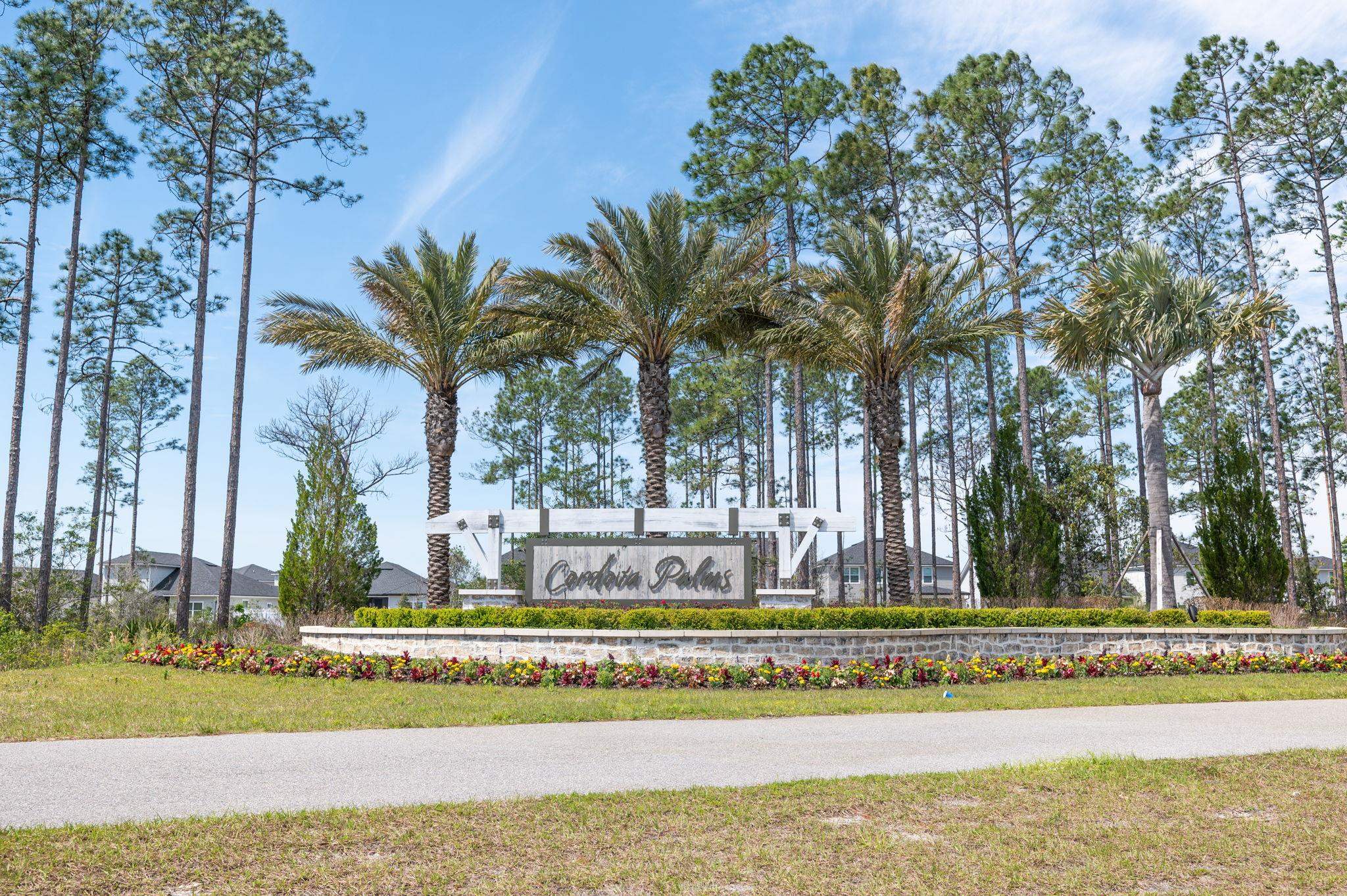 71 Barbosa Trail St. Augustine, FL 32095 - Photo 50 of 51 a front view of a house with swimming pool and sitting area