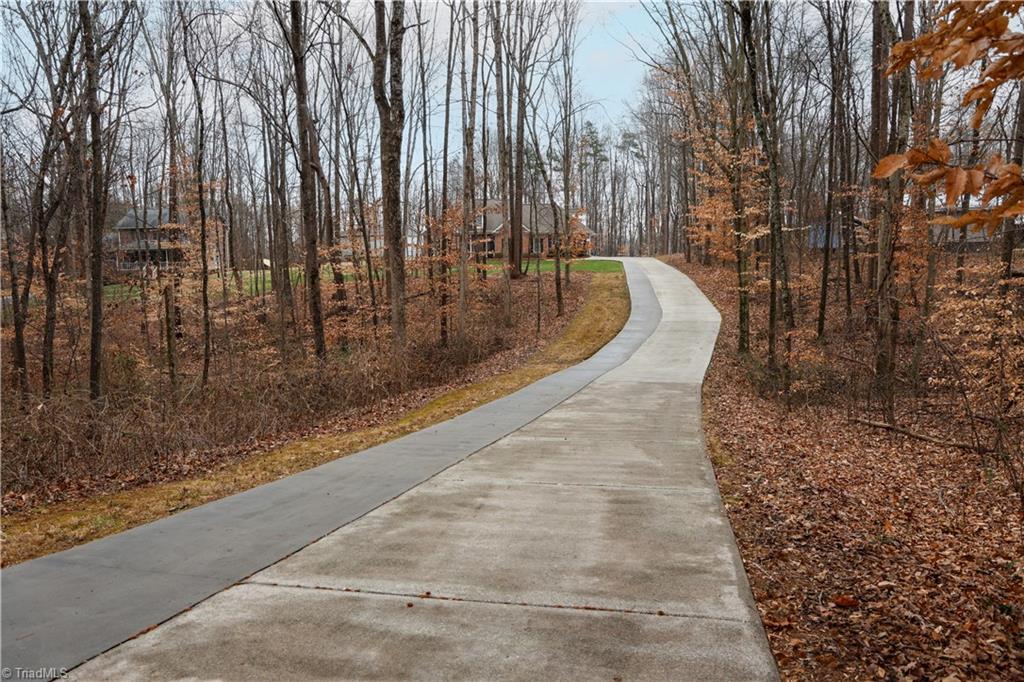 7925 Old Salisbury Road Linwood, NC 27299 - Photo 29 of 31 Long concrete driveway