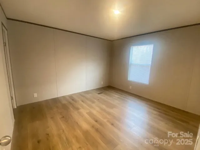 an empty room with a empty space and a window