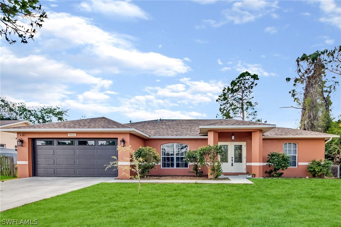 9056 Aster Road Fort Myers, FL 33967 - Photo 5 of 6 a view of a house with a yard and sitting area