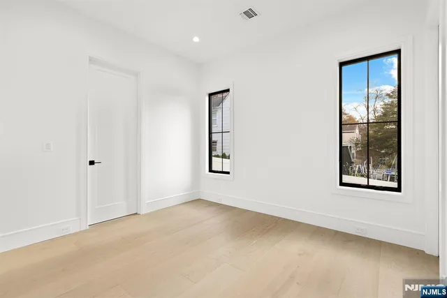 a bathroom with a shower sink vanity and toilet