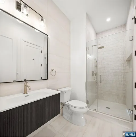 a spacious bedroom with a bed and a couch