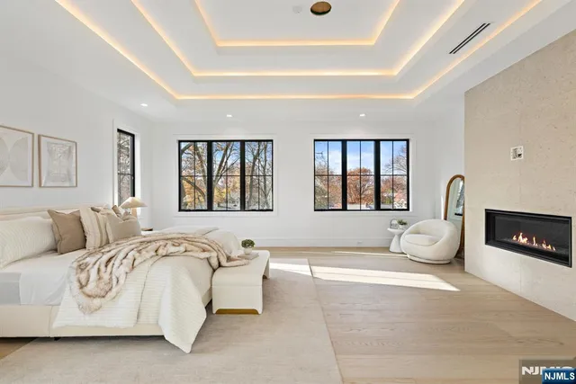 an empty room with cabinet and windows