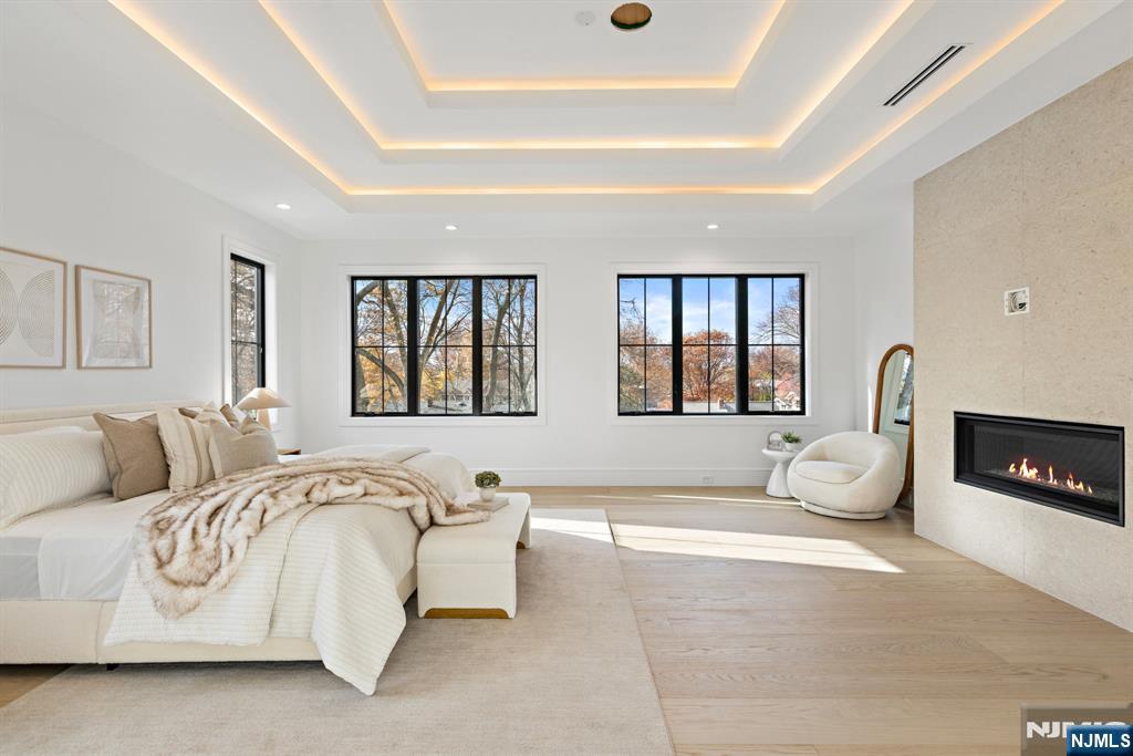 375 Burnet Place Paramus, NJ 07652 - Photo 13 of 37 a spacious bedroom with a bed and a couch