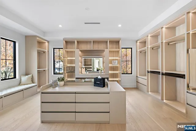 a dining table chair next to a window