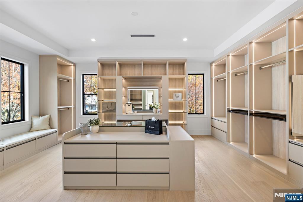 375 Burnet Place Paramus, NJ 07652 - Photo 15 of 37 a kitchen with kitchen island a counter top space a sink and a large window