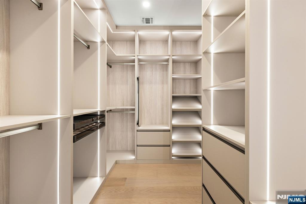 375 Burnet Place Paramus, NJ 07652 - Photo 17 of 37 a view of walk in closet with empty racks