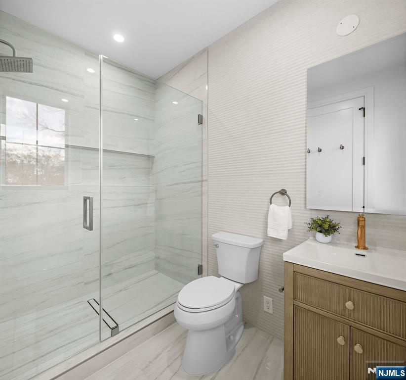 375 Burnet Place Paramus, NJ 07652 - Photo 24 of 37 a bathroom with a granite countertop sink a toilet and shower